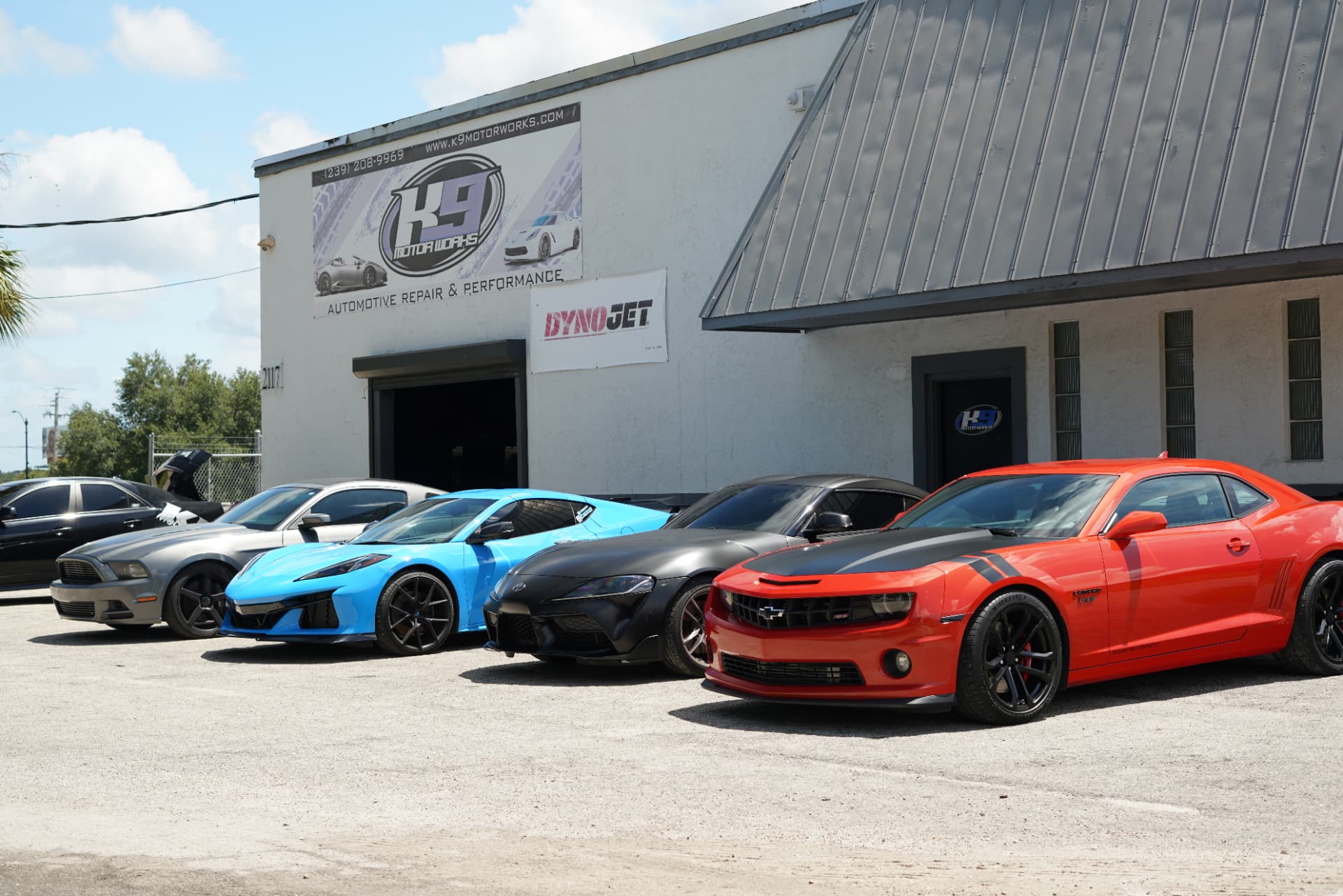 K9 Motorworks shop with performance cars lined up out front